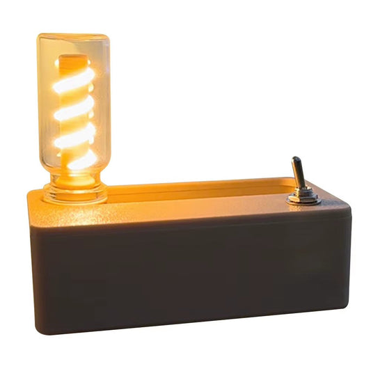 Mechanical night light with toggle switch and glowing spiral bulb on rectangular base for indoor ambient lighting